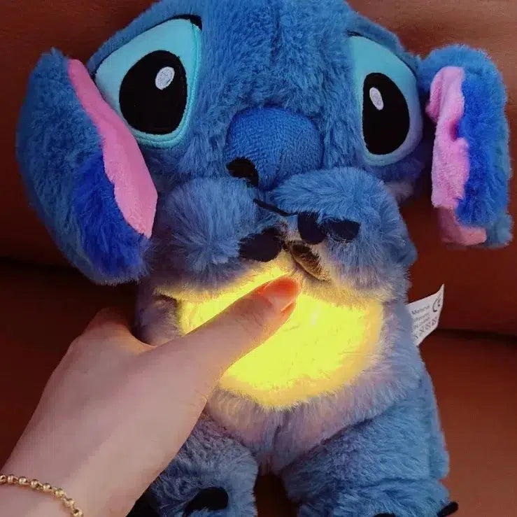 Peluche que respira Stitch con canción de cuna relajante